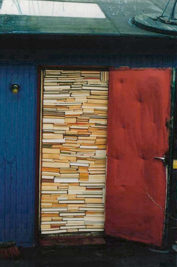 A door stuffed with books